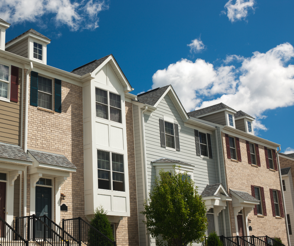 Townhomes against a clear blue sky